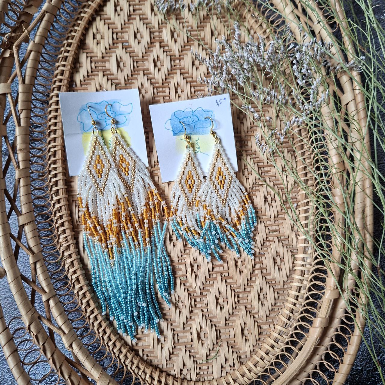 Detailed seed bead earrings with diamond design