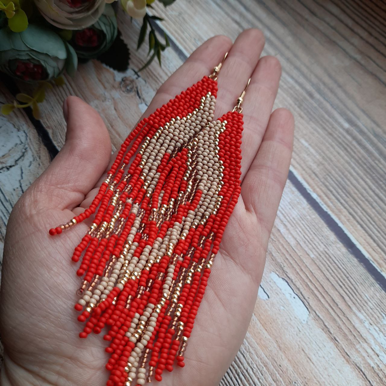 Handmade red beaded fringe earrings with beautiful geometric design.