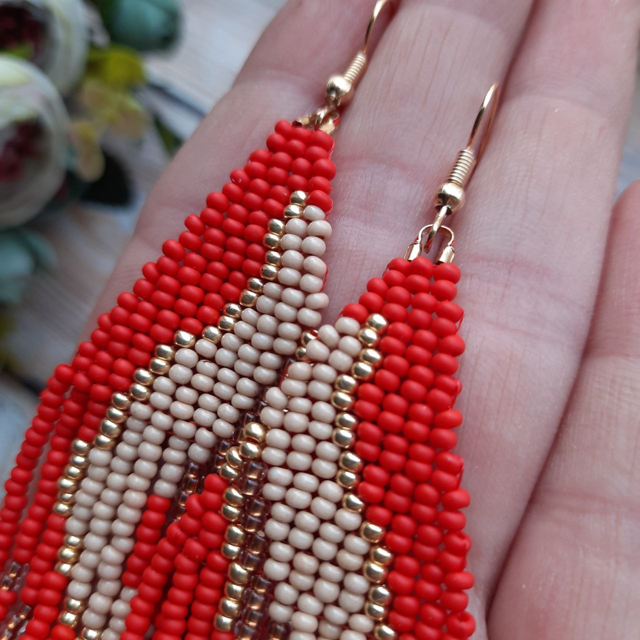 Boho style handmade earrings with vibrant red seed beads.
