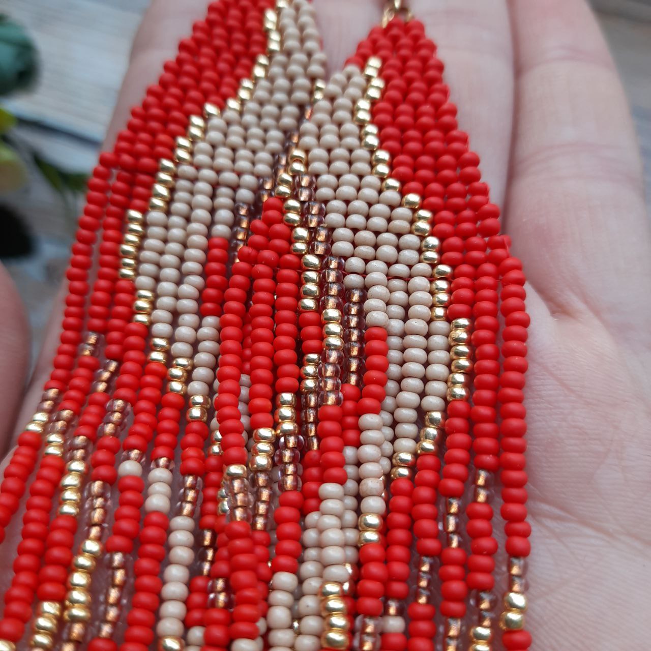 Beautiful handcrafted fringe earrings with ethnic bead pattern.